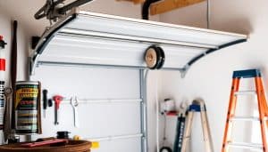 What tasks are included in regular garage door maintenance?